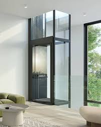 Sleek glass home elevator in a bright modern living space — HighQualityLifts Belgium