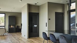 Contemporary home with integrated residential elevator doors — HQL Belgium